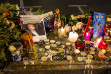 Candles, flowers and a Russian constitution surround a photo of Boris Nemtsov left a few meters from where he was killed.