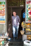 Giorgi standing in front of a convenience store in Tbilisi.