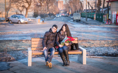 Artem and Yulia sitting on a bench near the seaside in Vladivostok