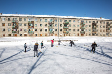 Russian children playing hockey in front of home on Sakhalin.