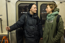 Sergei & Anna talking on the Moscow metro.