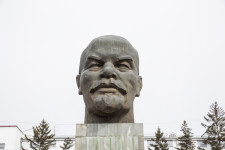 Medegma was standing across from the Lenin head as she waited for the bus.