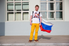 Daniil in his Putin shirt and Russian flag.